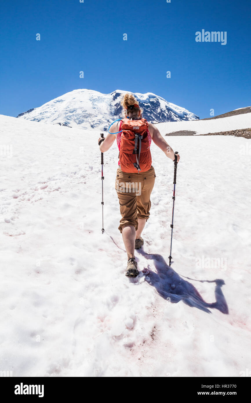 A woman hiking on the Burroughs Mountain trail in Mount Rainier ...