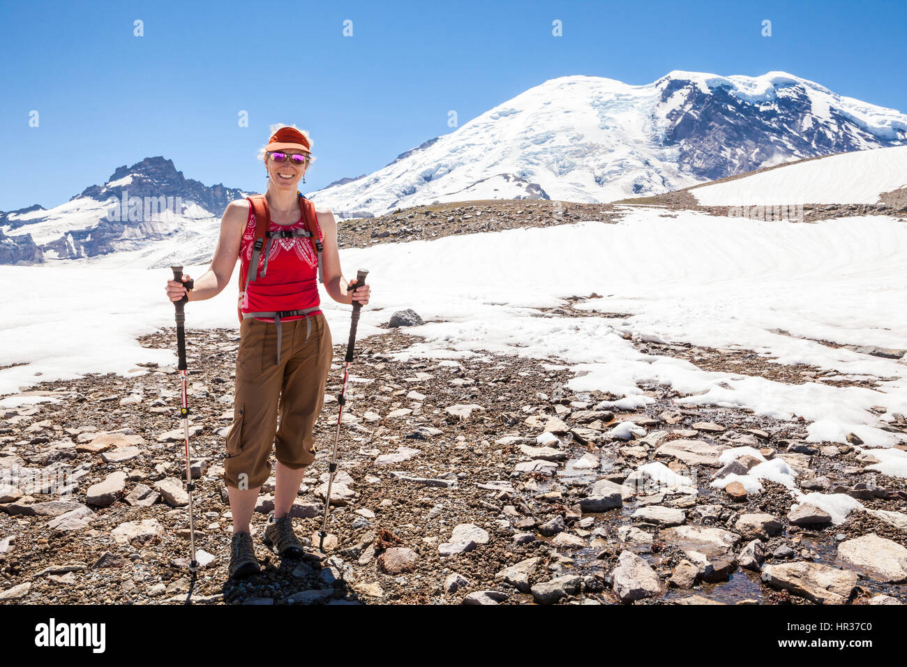A woman hiking on the Burroughs Mountain trail in Mount Rainier ...