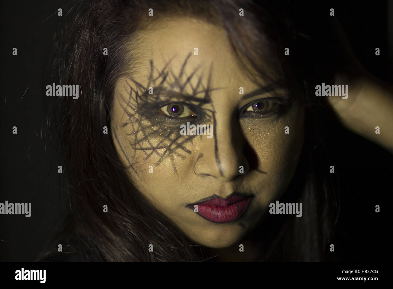 Portrait of young woman with face paint Stock Photo - Alamy