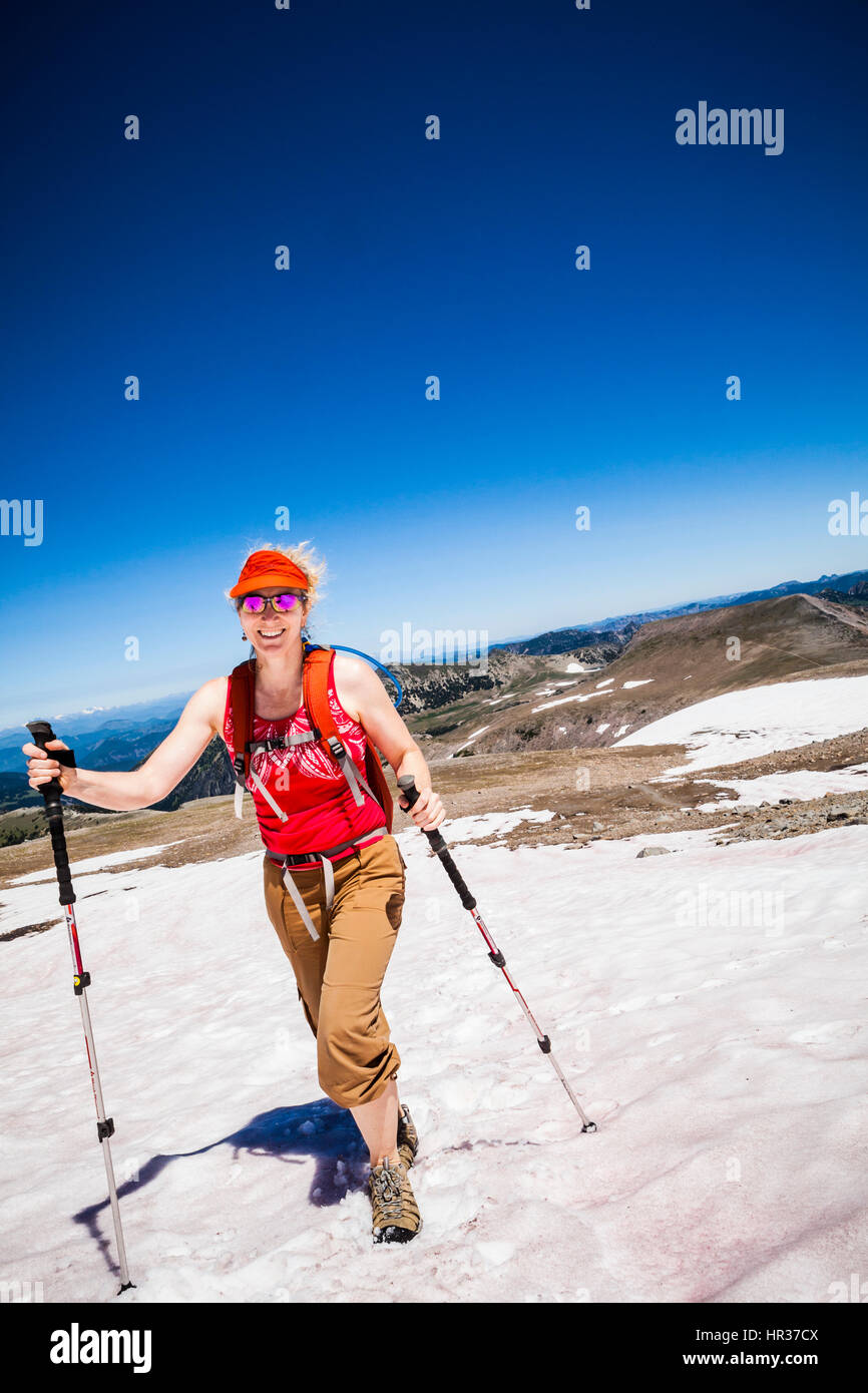A woman hiking on the Burroughs Mountain trail in Mount Rainier ...