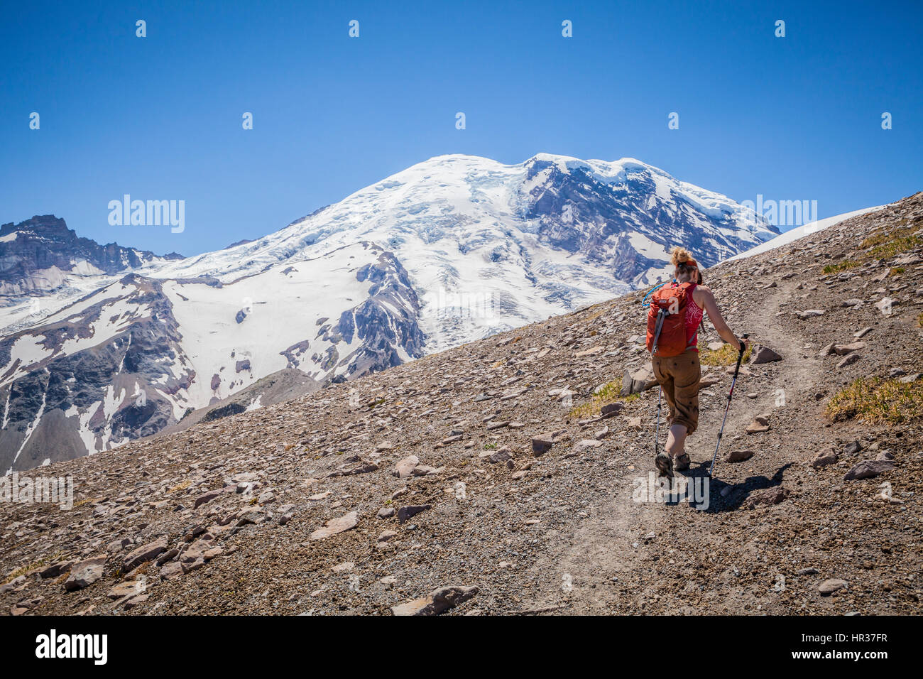Mature woman hiking on trail hi-res stock photography and images - Alamy