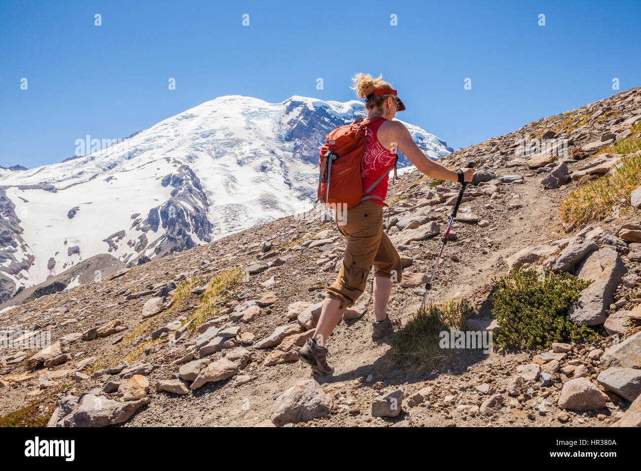 A woman hiking on the Burroughs Mountain trail in Mount Rainier ...