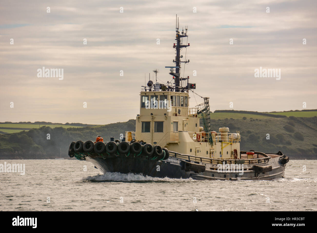 Tug Westgarth heading up Milford Haven at Angle on a calm summers afternoon Stock Photo