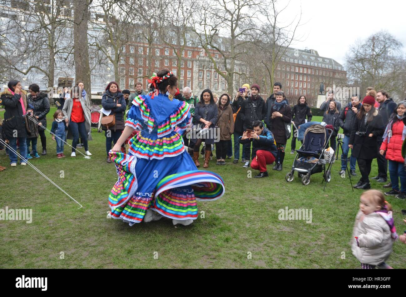 London, UK. 26th February 2017. Mexican women invite families in London and surrounding areas to build a wall of hope in front of the U.S. Embassy on the 26th February. You are invited to come with your family and to bring something to stick on the mural of hope Credit: Philip Robins/Alamy Live News Stock Photo