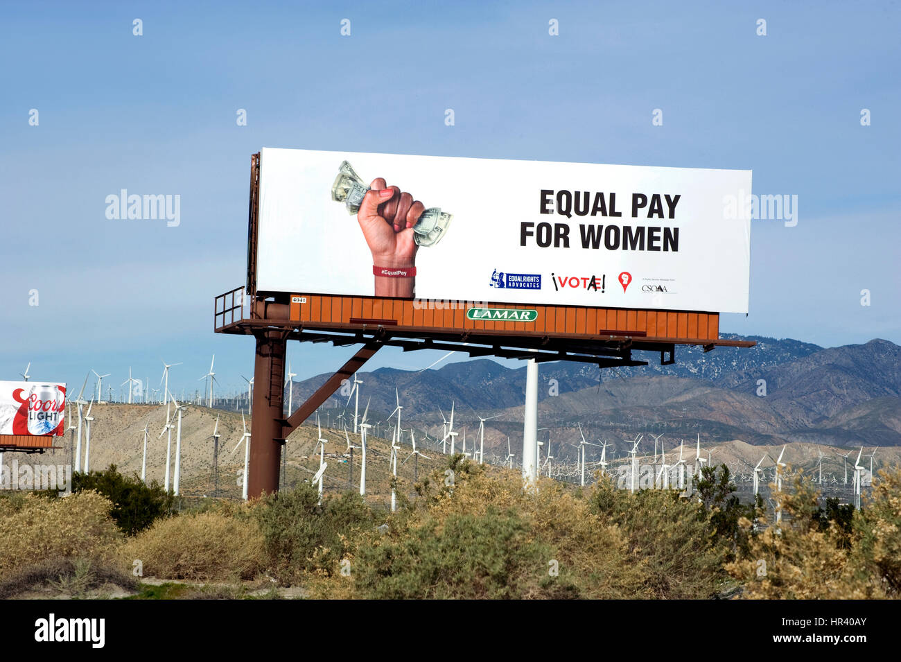 Billboard supporting equal pay for women in the desert near Palm Springs, CA Stock Photo