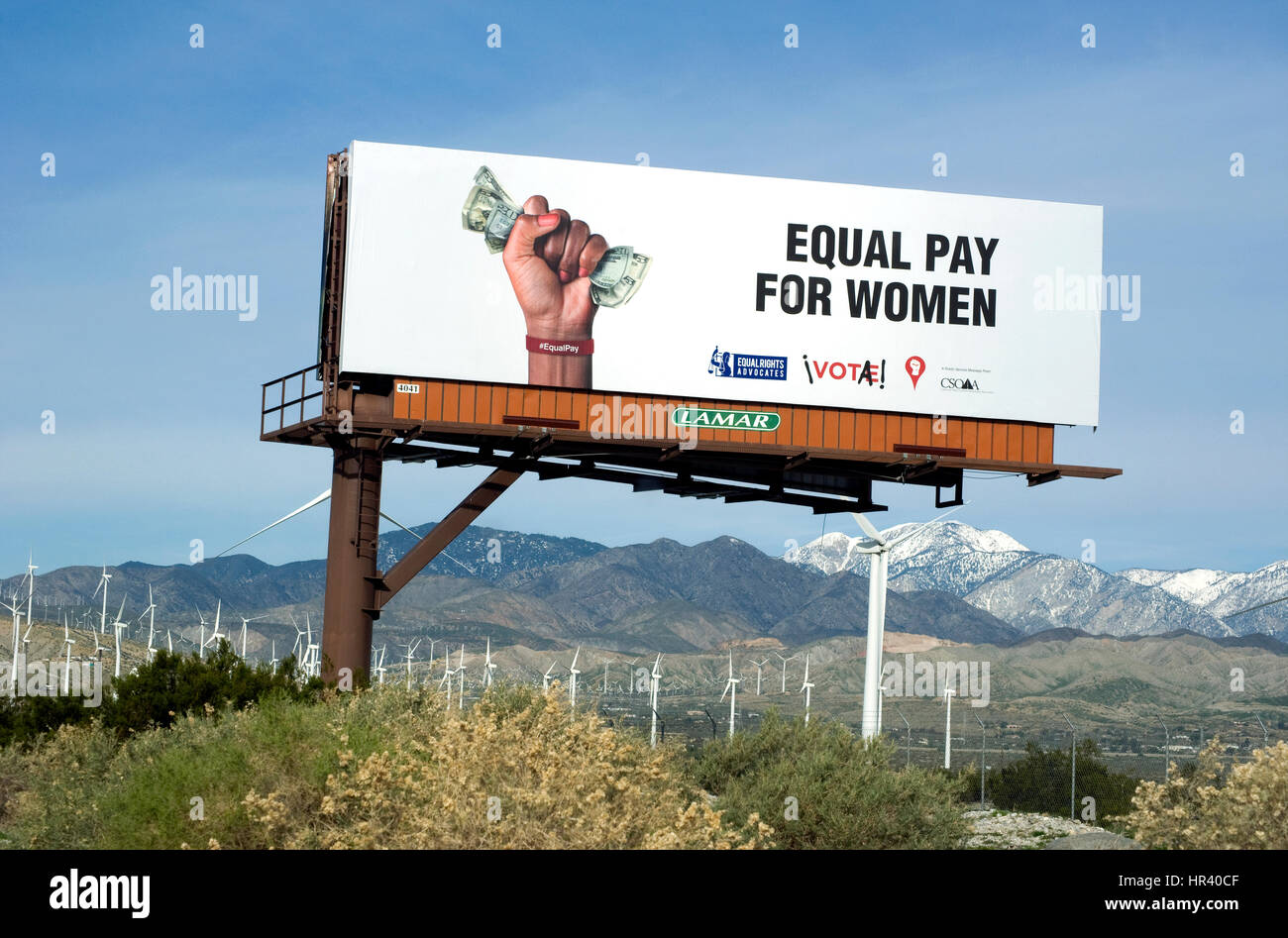 Billboard supporting equal pay for women in the desert near Palm Springs Stock Photo