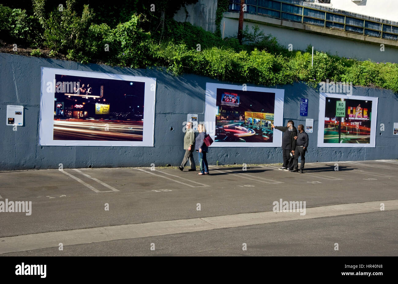 Installation of outdoor art exhibit on the Sunset Strip in Los Angeles featuring Robert Landau's photos documenting  rock billboards from the 1970s. Stock Photo