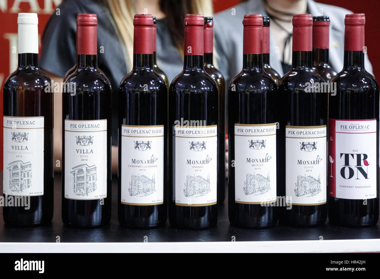 BELGRADE, SERBIA - FEBRUARY 25, 2017: Bottles of red and white wine from Serbia on display at a stand of the 2017 Tourism fair of Belgrade  Pictures o Stock Photo