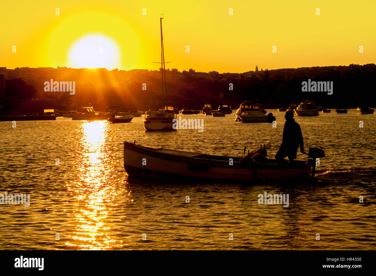 Man standing in small boat hi-res stock photography and images - Alamy