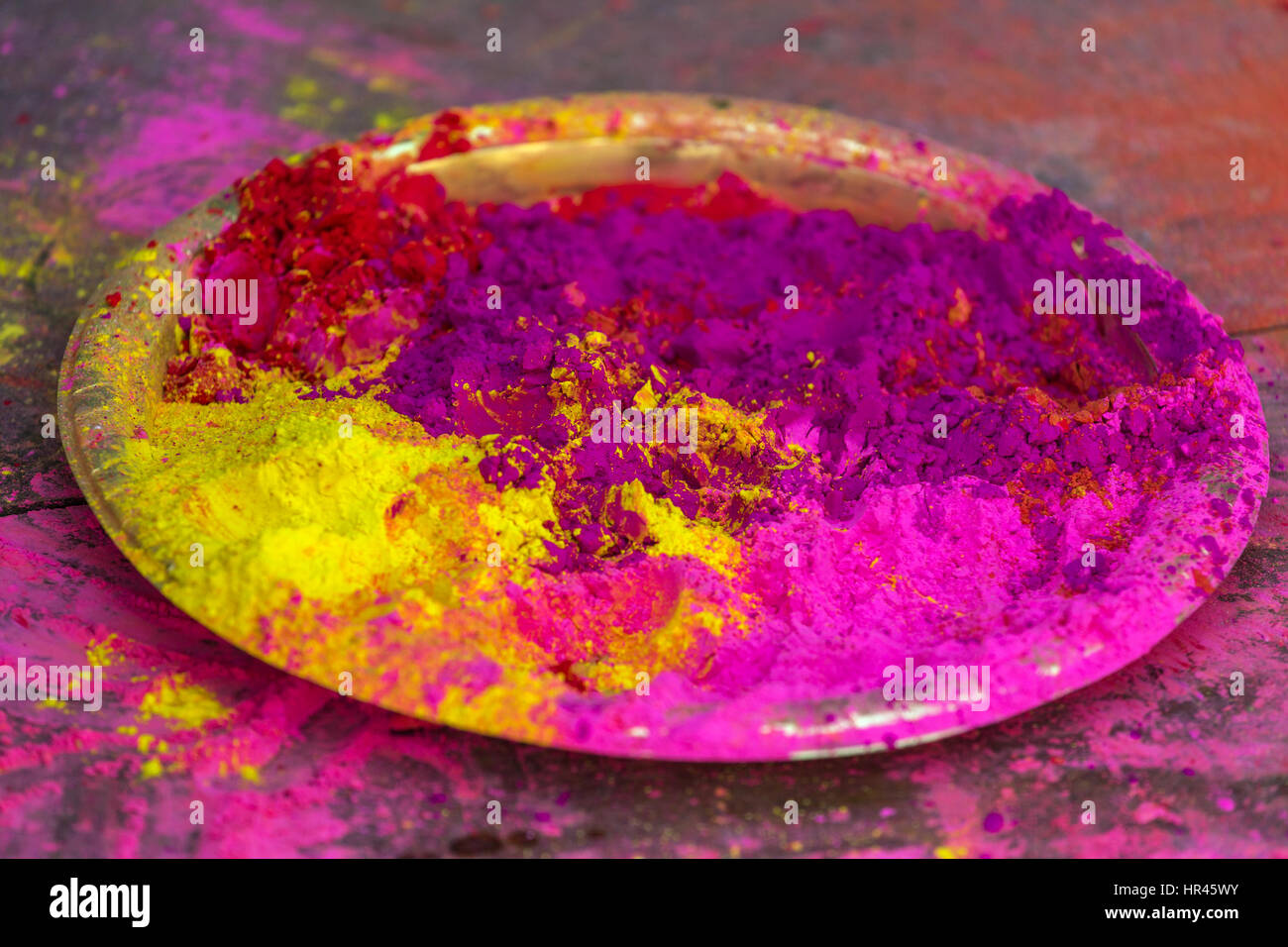 Plate with colorful dyes used for Holi festival in India Stock Photo