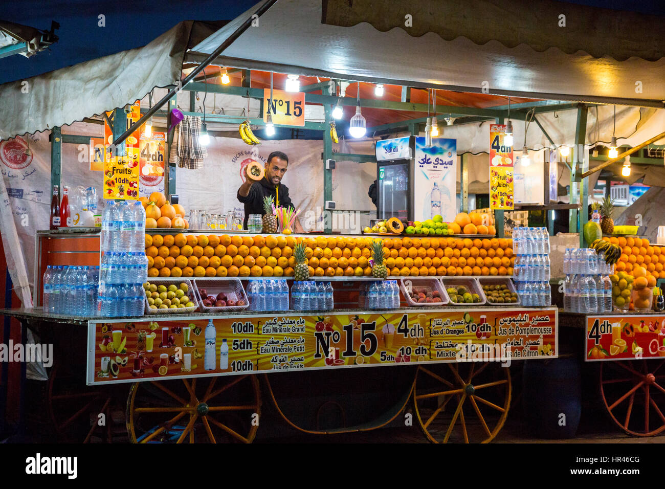 Marrakesh, Morocco.  Vendor of Fruit Juice and Bottled Water, Place Jemaa El-Fna. Stock Photo
