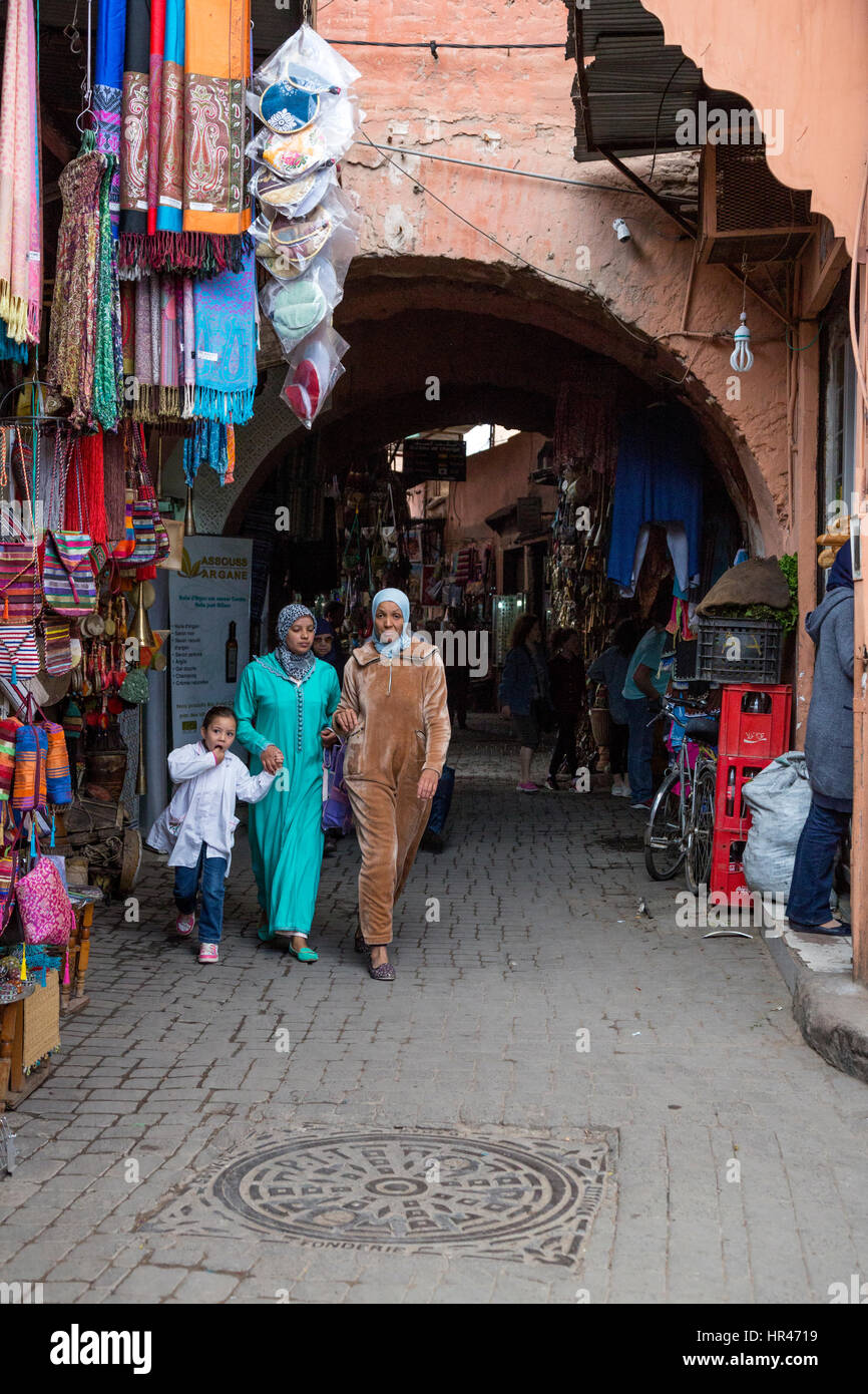 Marrakesh, Morocco.  Women and Little Girl Walking in the Medina. Stock Photo