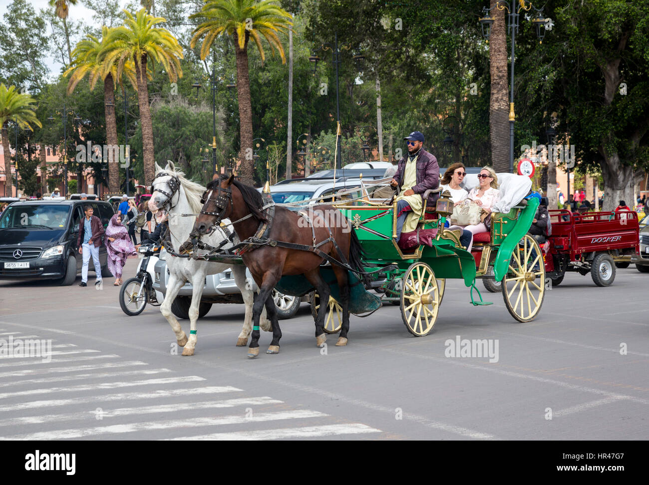 Marrakesh, Morocco.  Tourists in Horse-drawn Carriage. Stock Photo