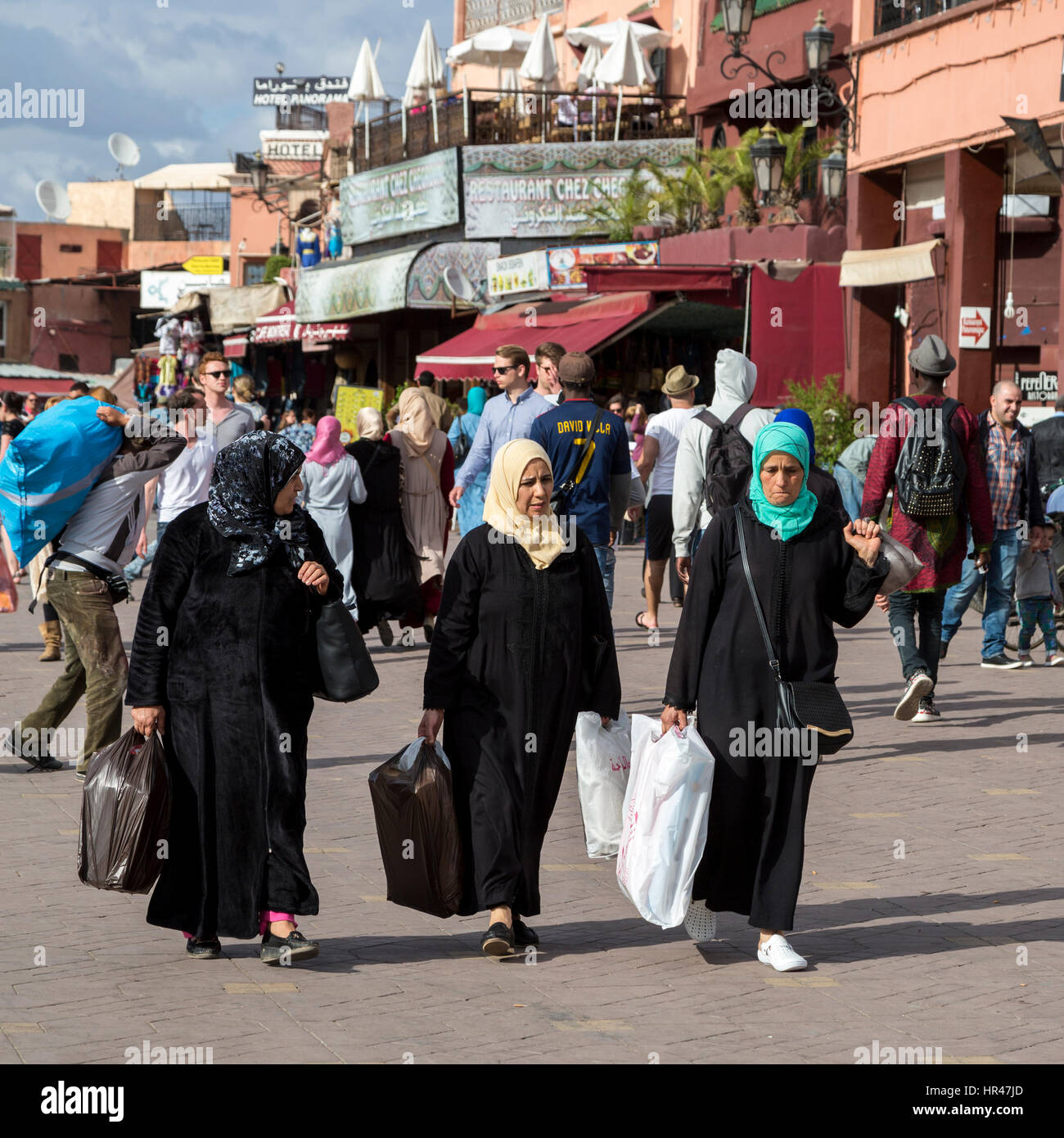 Marrakesh, Morocco.  Moroccan Women Going Home after Shopping. Stock Photo