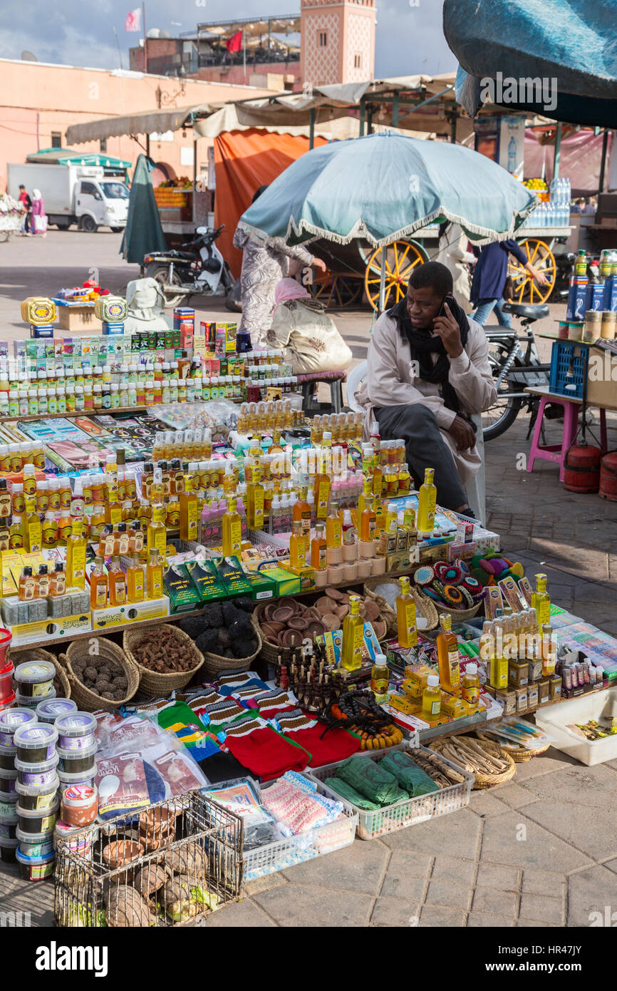 Marrakesh, Morocco.  Vendor of Argan Oil and Assorted Personal Accessories, Place Jemaa El Fna. Stock Photo
