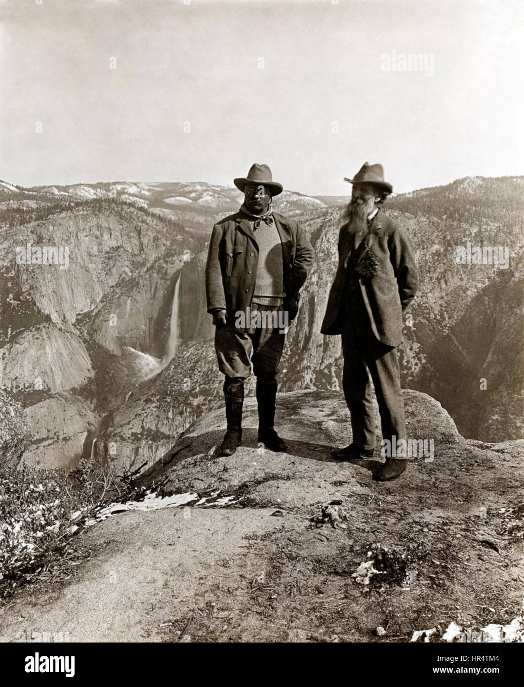 President Theodore Roosevelt (1858-1919) and naturalist John Muir (1838-1914) standing on Glacier Point in Yosemite Valley, California in 1903 during a camping trip. Muir’s passion for the preservation of wilderness areas in the United States conveyed through his writing helped bring about the creation of the US National Park Service in 1916. Stock Photo