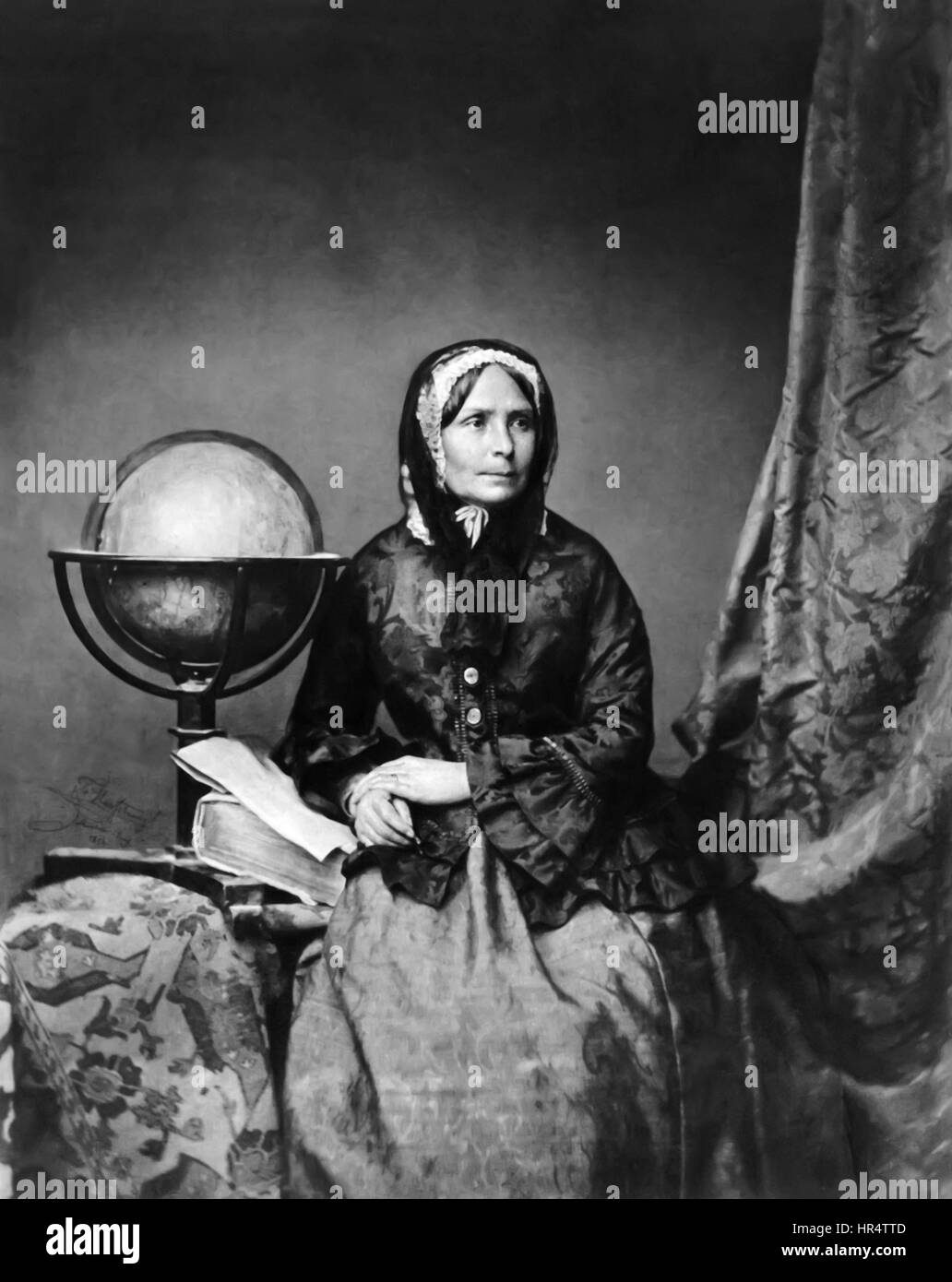 Ida Laura Pfeiffer (1797-1858) Austrian explorer and bestselling travel writer and keen naturalist. Studio photograph with globe taken by Franz Seraph Hanfstaengl (1804-1877) Munich in 1856. Stock Photo