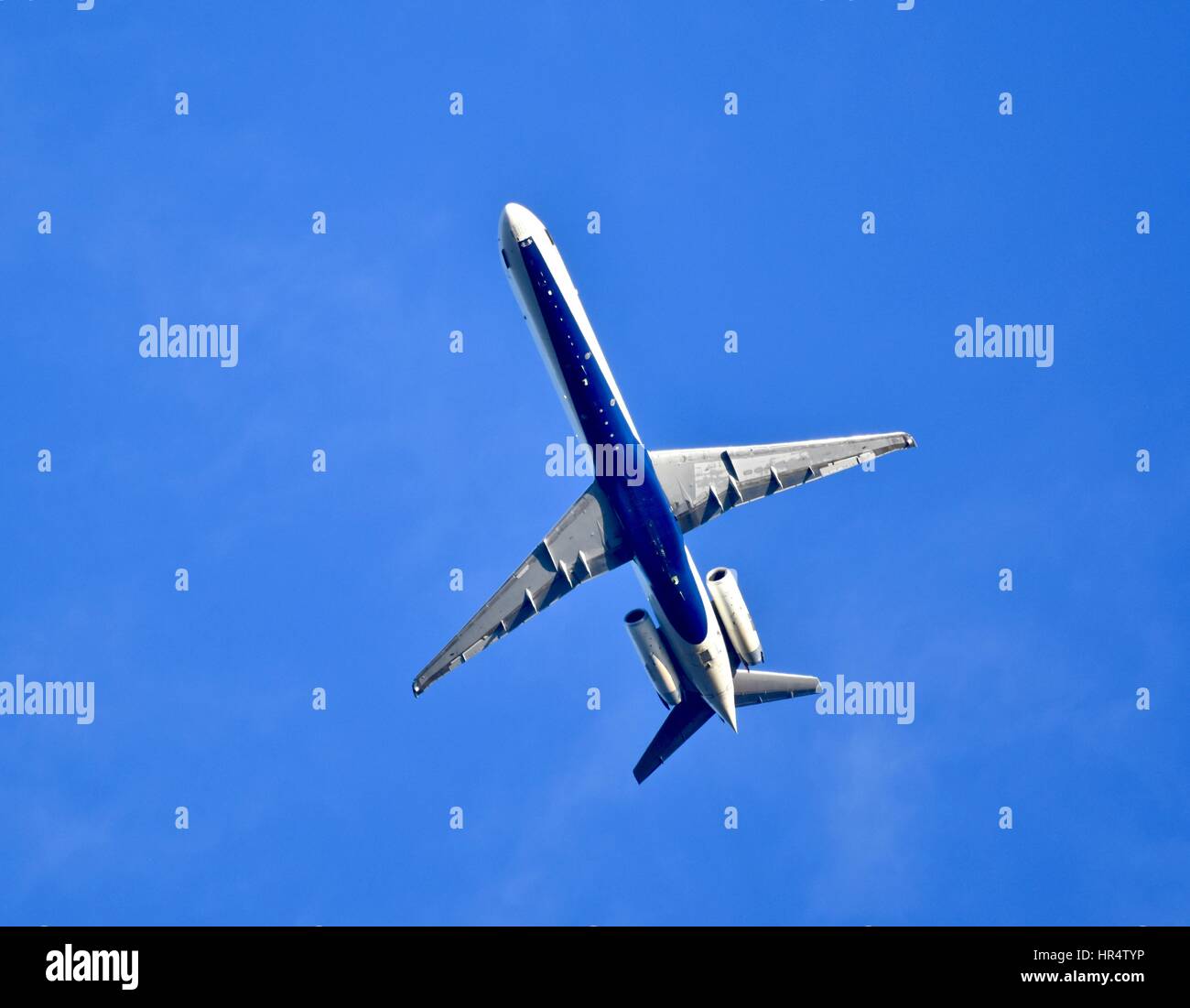 Airliner jet flying high above Stock Photo - Alamy