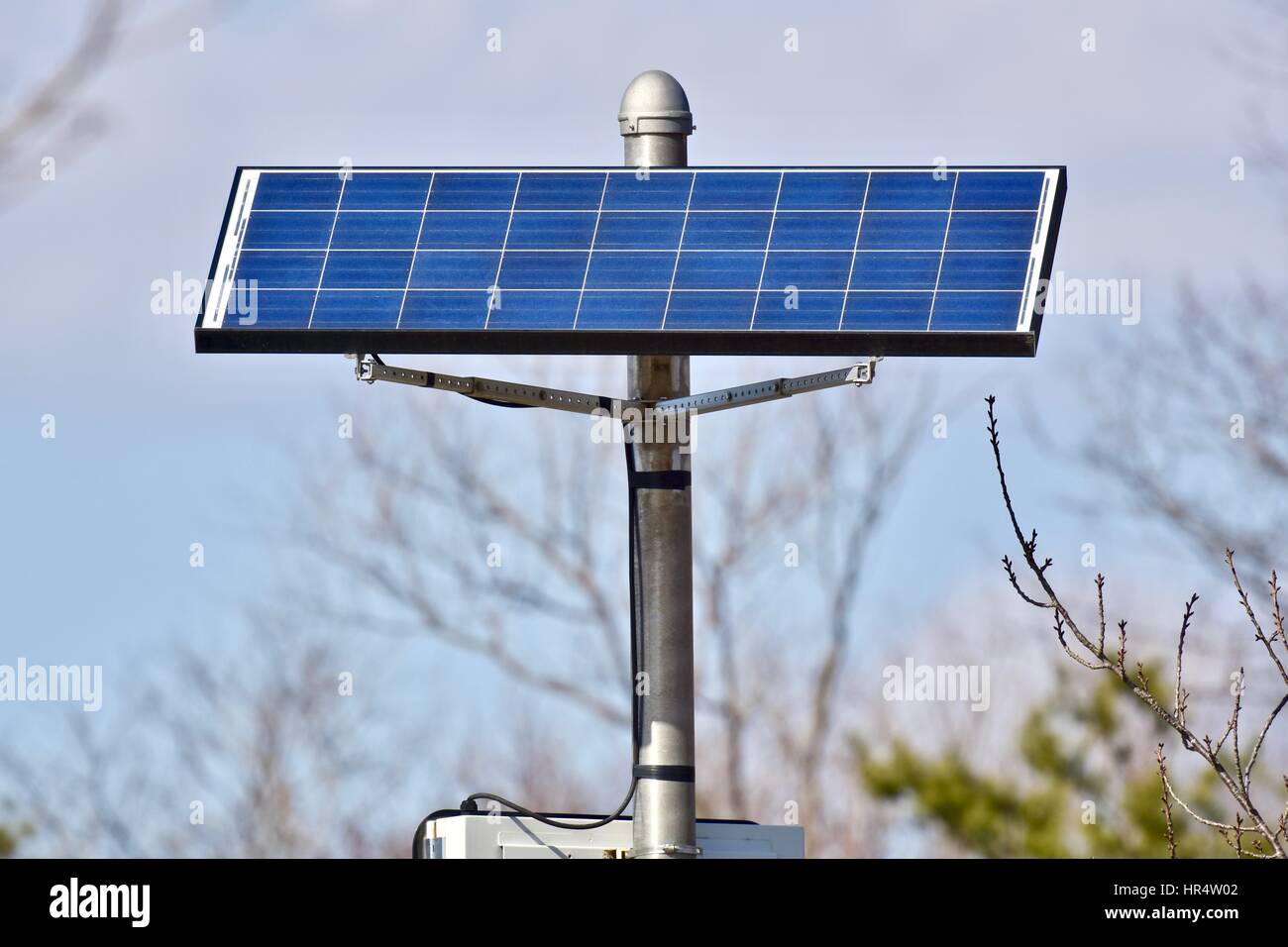 Solar panel powering a speed light on the street Stock Photo