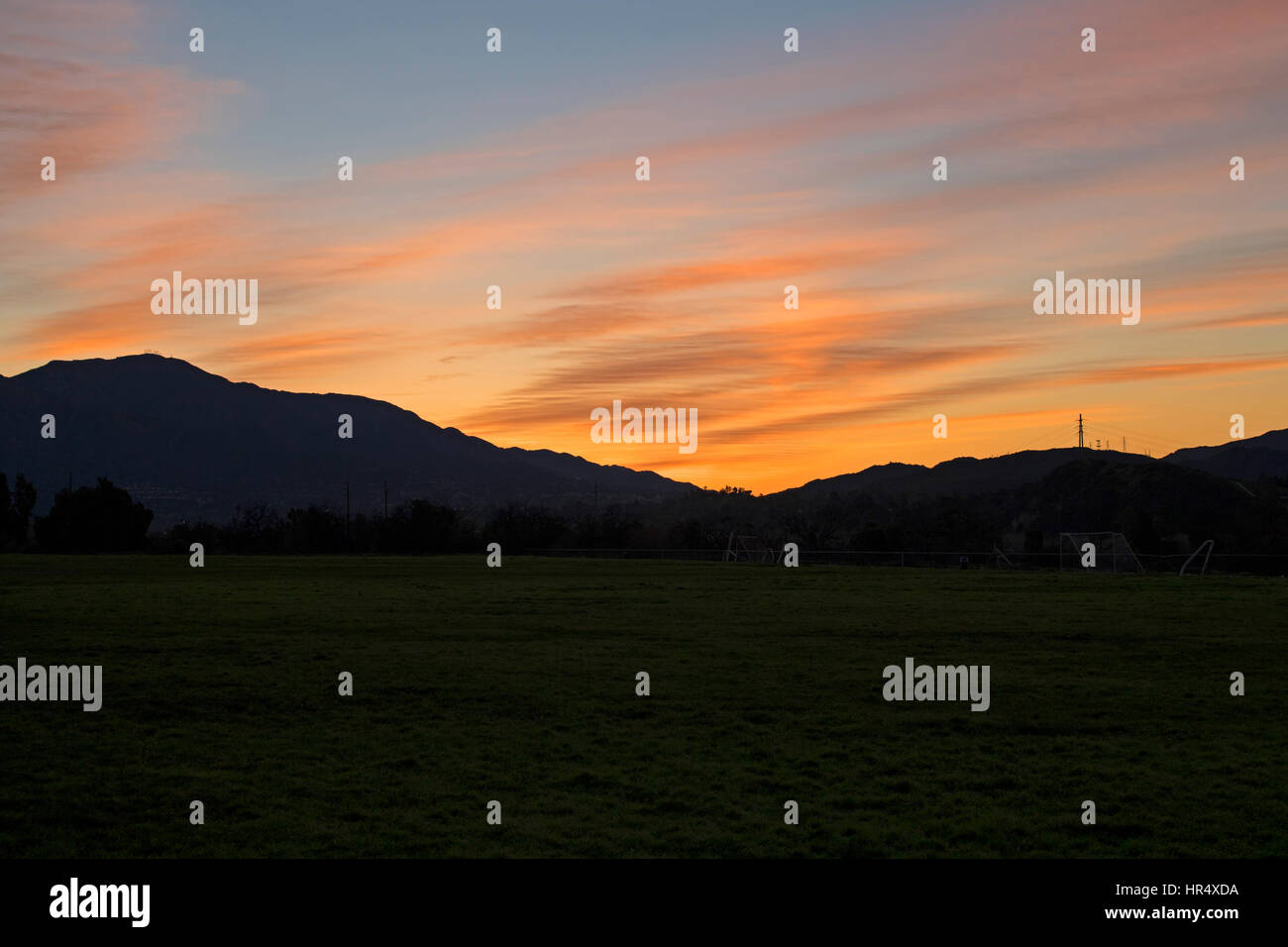 Sunrise at suburban park soccer field Stock Photo