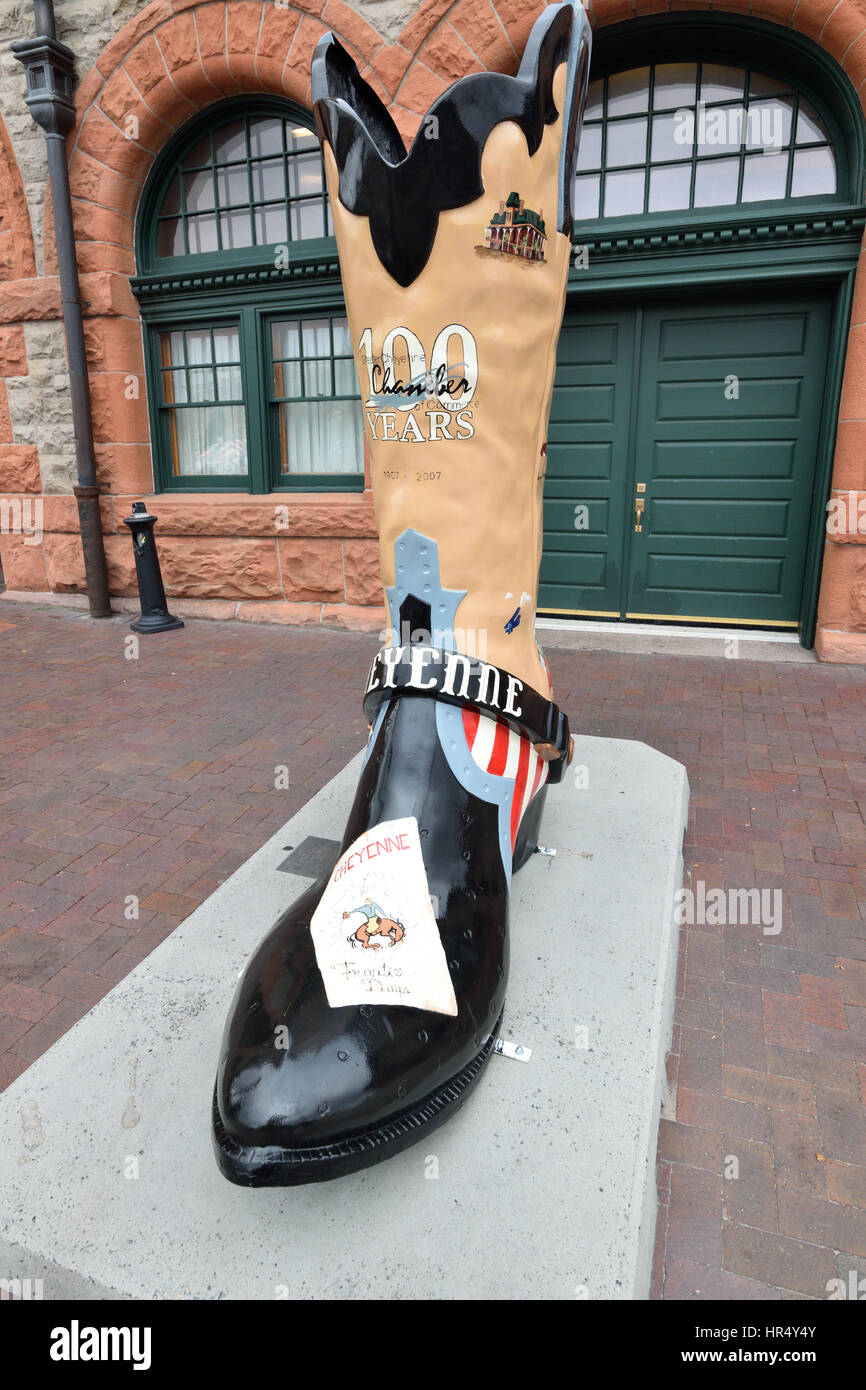A boot sculpture celebrating the centennial of Cheyenne Wyoming sits outside the downtown train depot. Stock Photo
