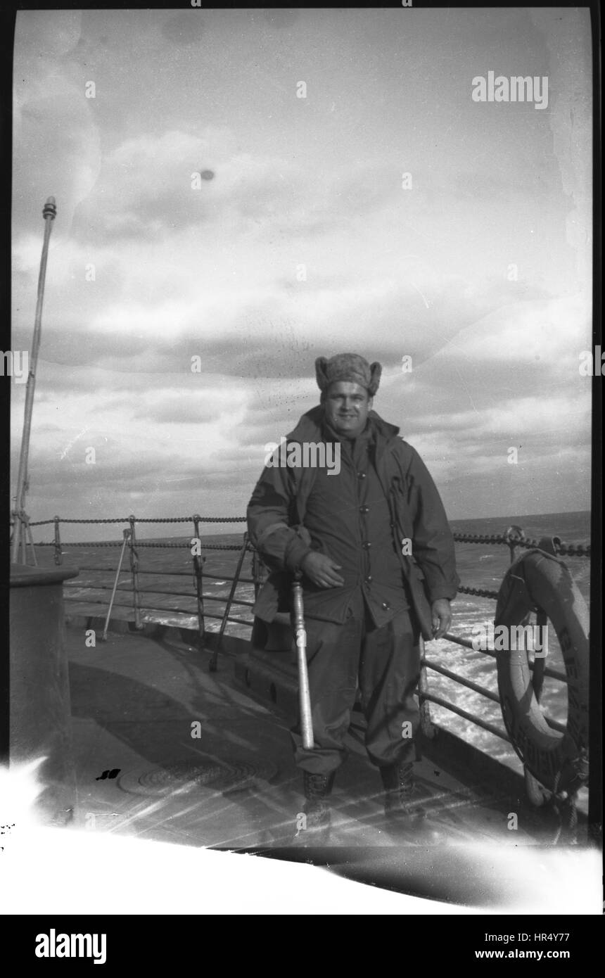 Solider standing on deck of ship going to or returning from Korea in 1950 during the Korean War. Stock Photo