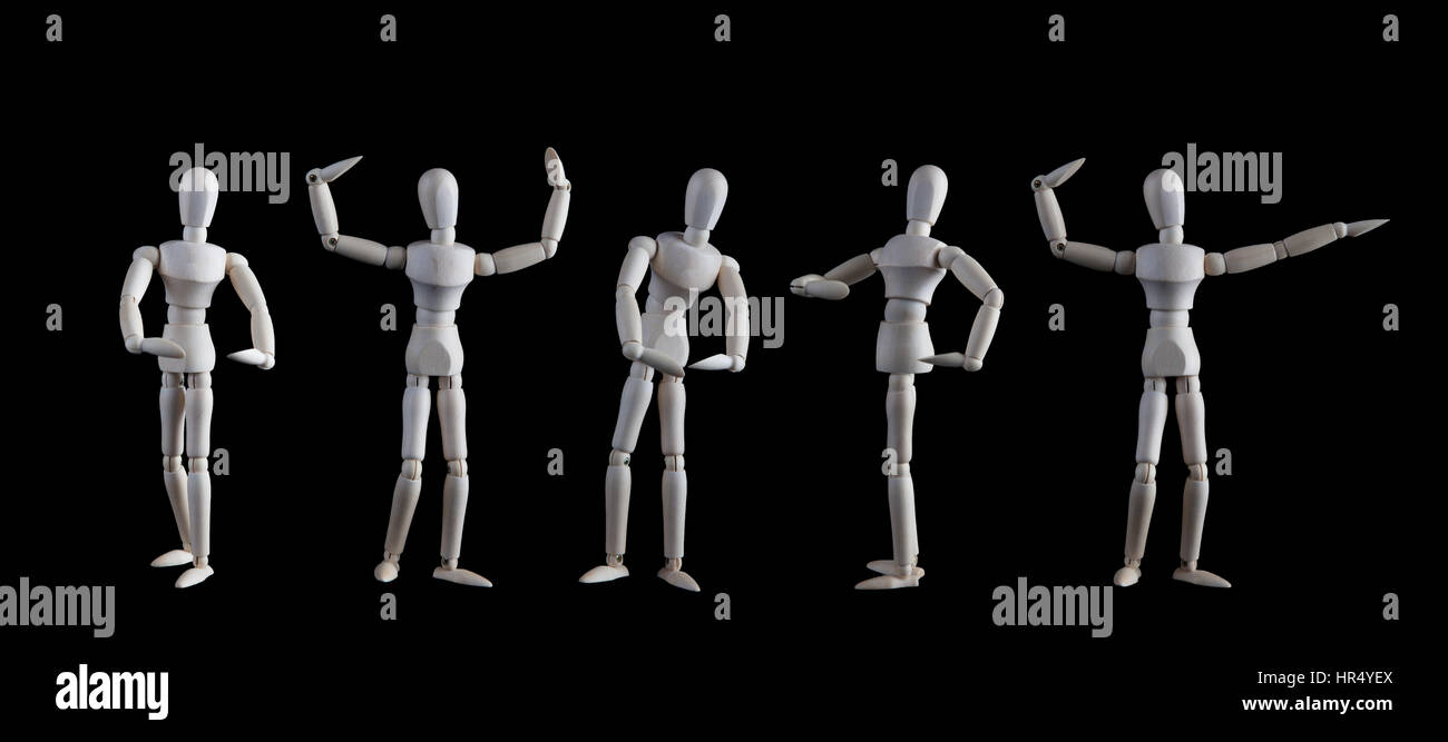 Set of wooden figurines posing as bodybuilders isolated on black background. Bodybuilders competition on stage concept Stock Photo