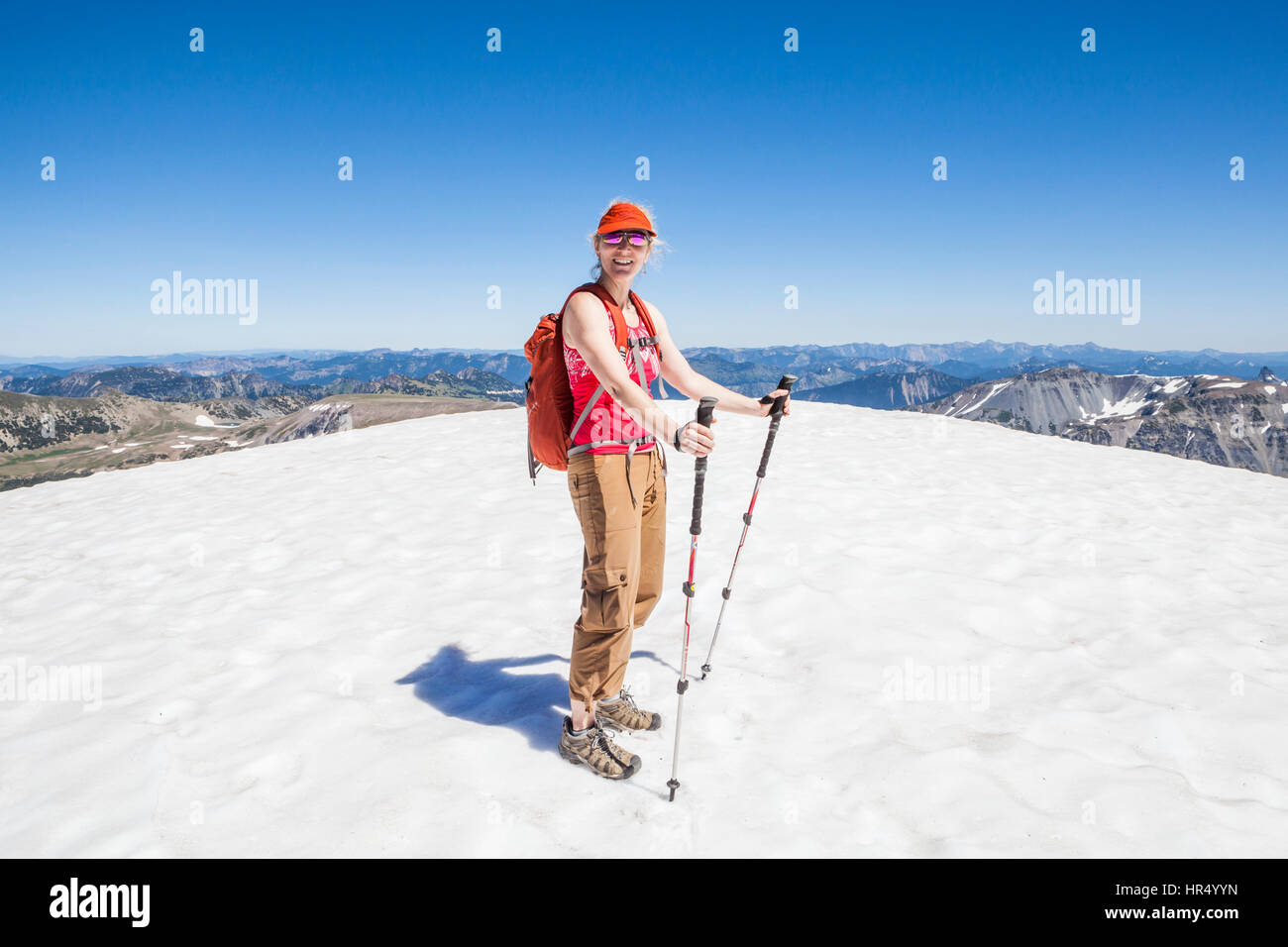 A woman hiking on the Burroughs Mountain trail in Mount Rainier ...