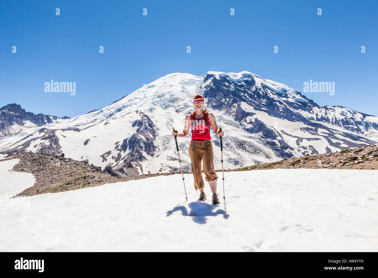 A woman hiking on the Burroughs Mountain trail in Mount Rainier ...