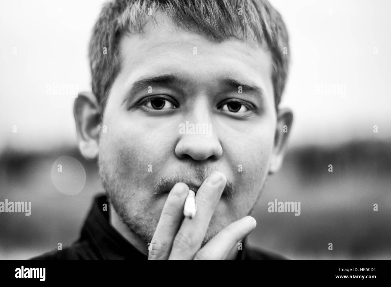 closeup portrait of male smokers Stock Photo Alamy