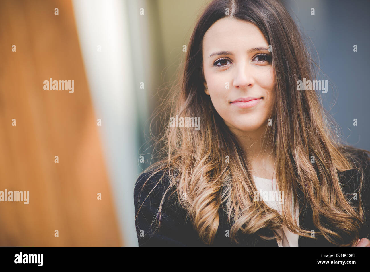 young authentic business woman in urban setting Stock Photo