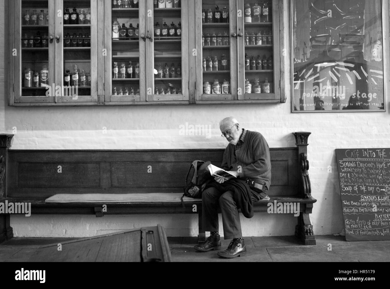 Man reading in Salt's Mill, Saltaire, Bradford, West Yorkshire Stock Photo