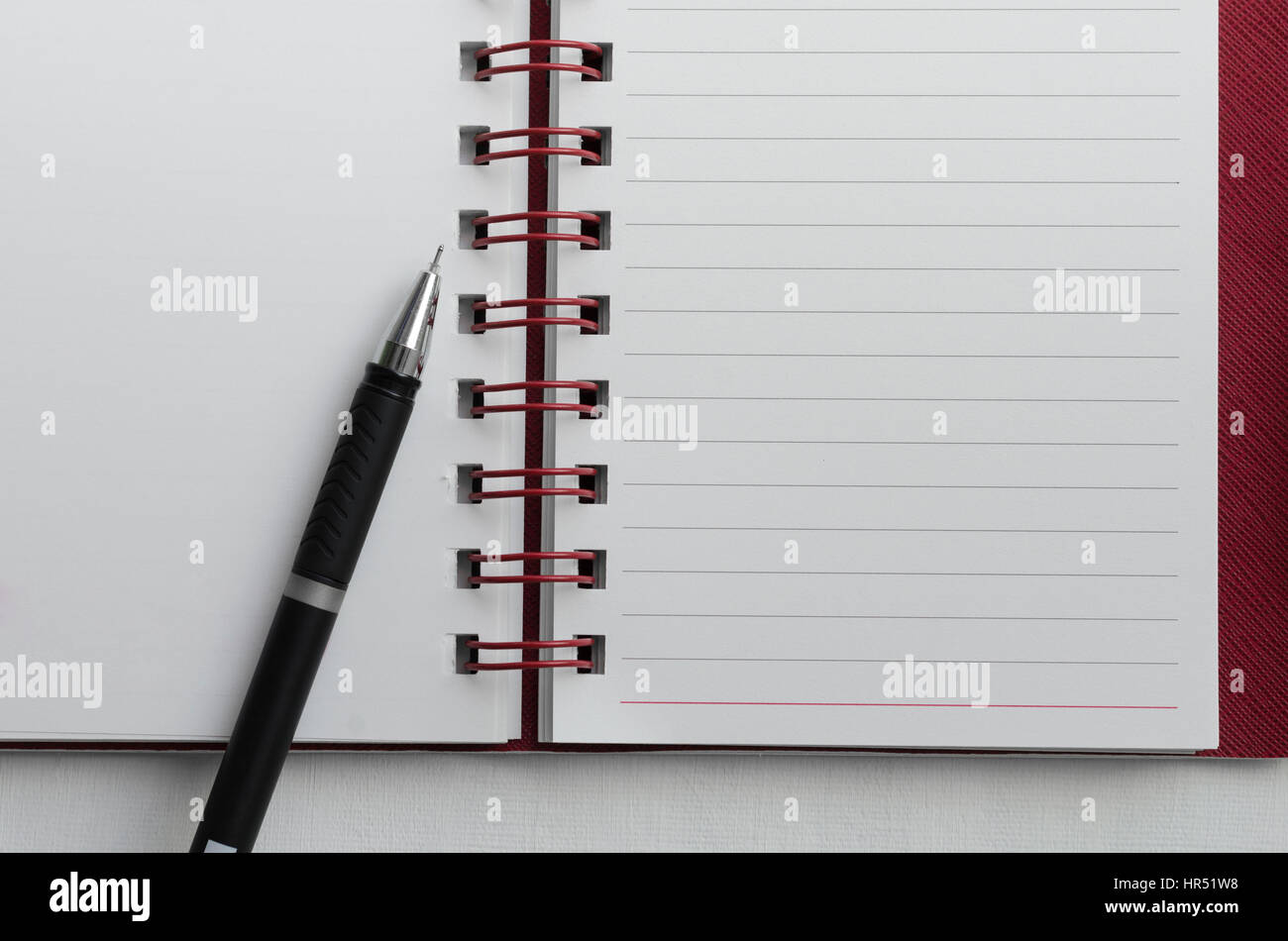 Wirebound Notebook with Blank White Paper and Pen. Stock Photo