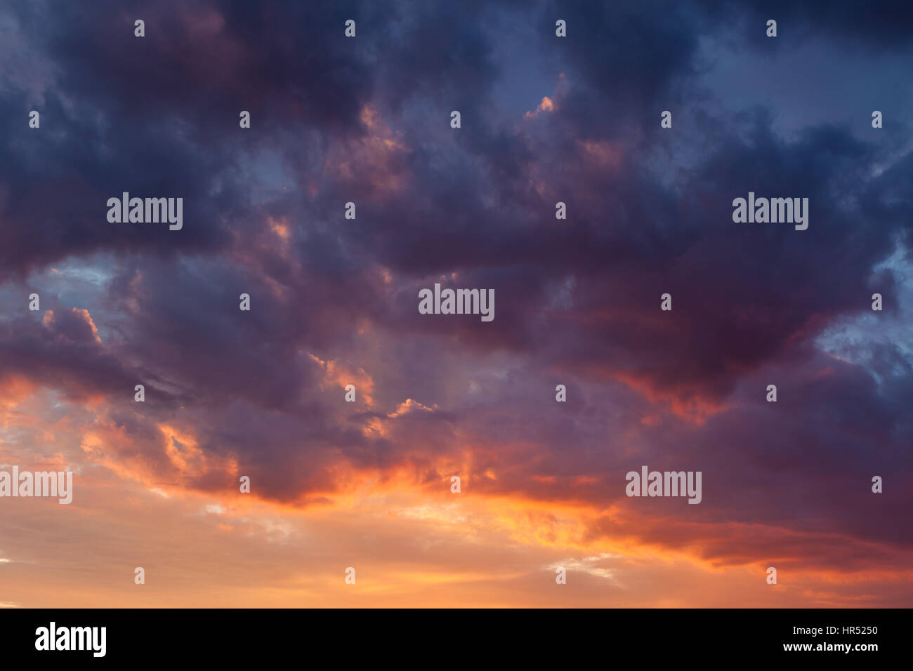 Fiery vivid colorful sunset sky clouds scape Stock Photo - Alamy