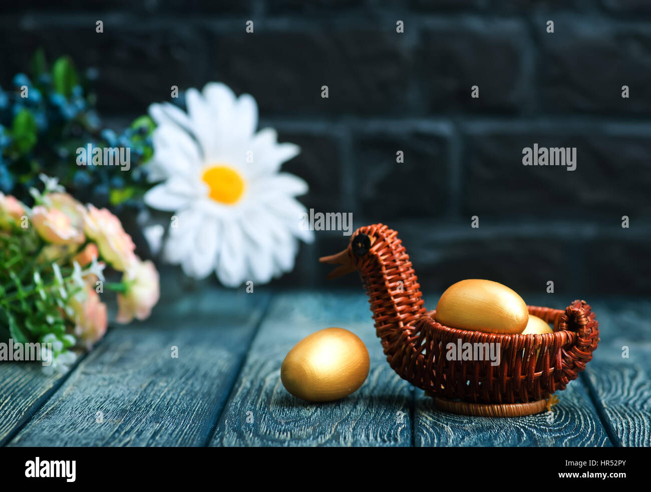 golden eggs, easter eggs on a table Stock Photo - Alamy