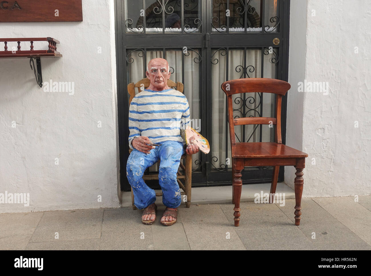 Sculpture in clay of Pablo Picasso sitting on chair in Mijas Pueblo, Andalusia, Spain Stock Photo