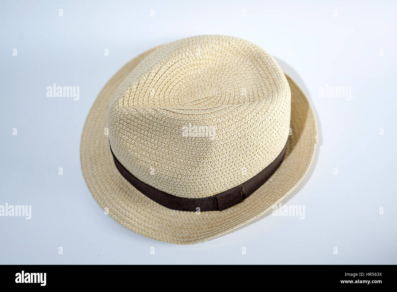 Old straw hat on a white background Stock Photo - Alamy