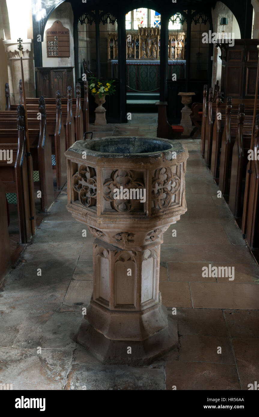 The font in St. Michael and All Angels Church, Stanton, Gloucestershire, England, UK Stock Photo