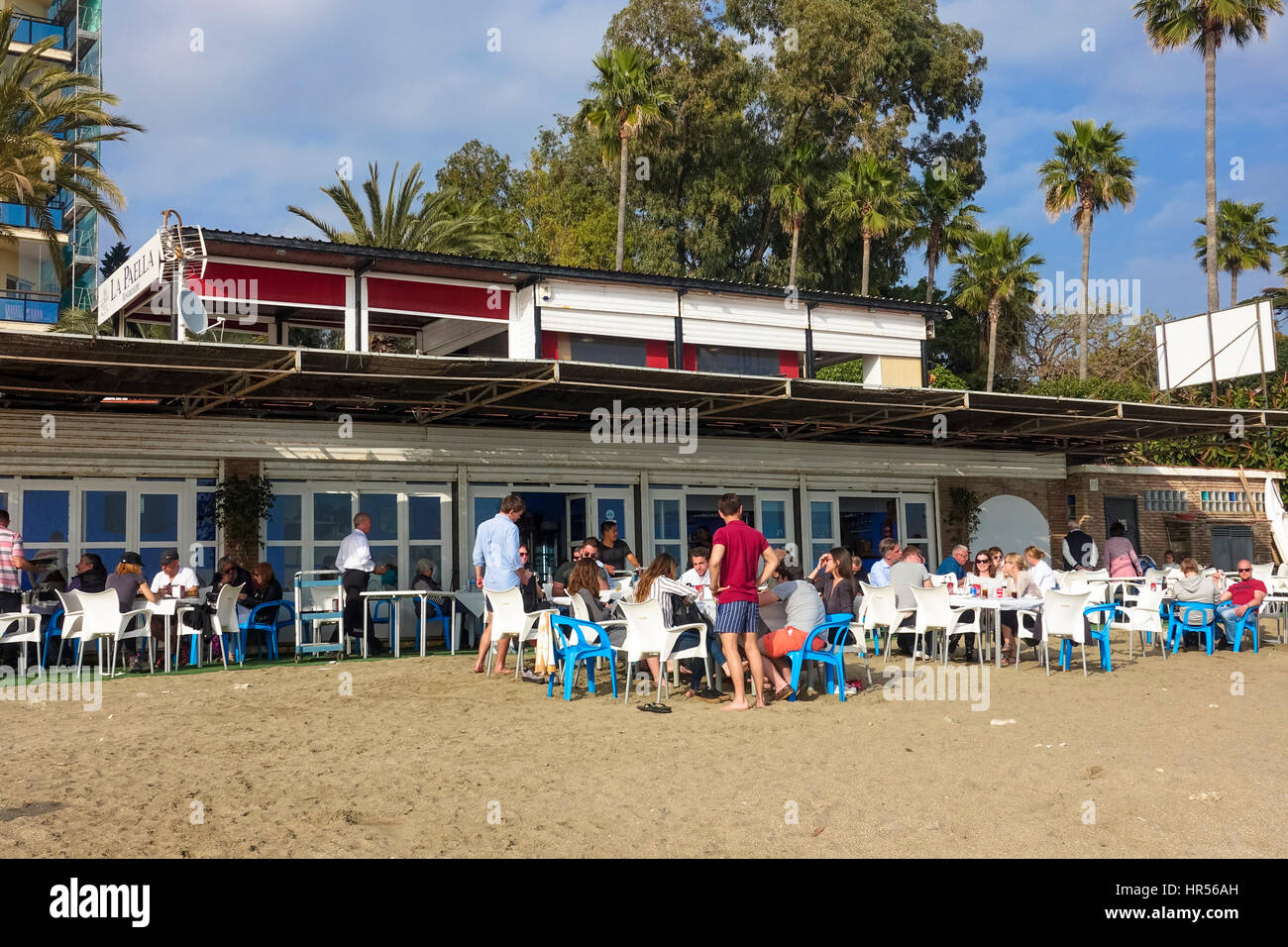 People at busy Frontline bars and beach restaurants, Port, Harbour