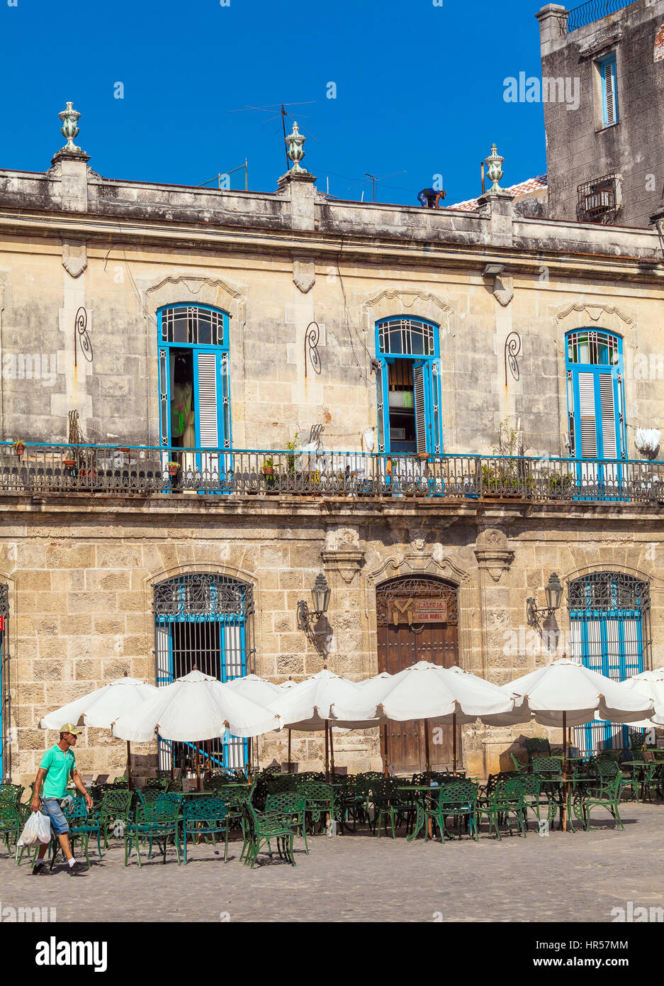 HAVANA, CUBA - APRIL 2, 2012: Tourist walking near El Patio Restaurant in the Cathedral Square Stock Photo