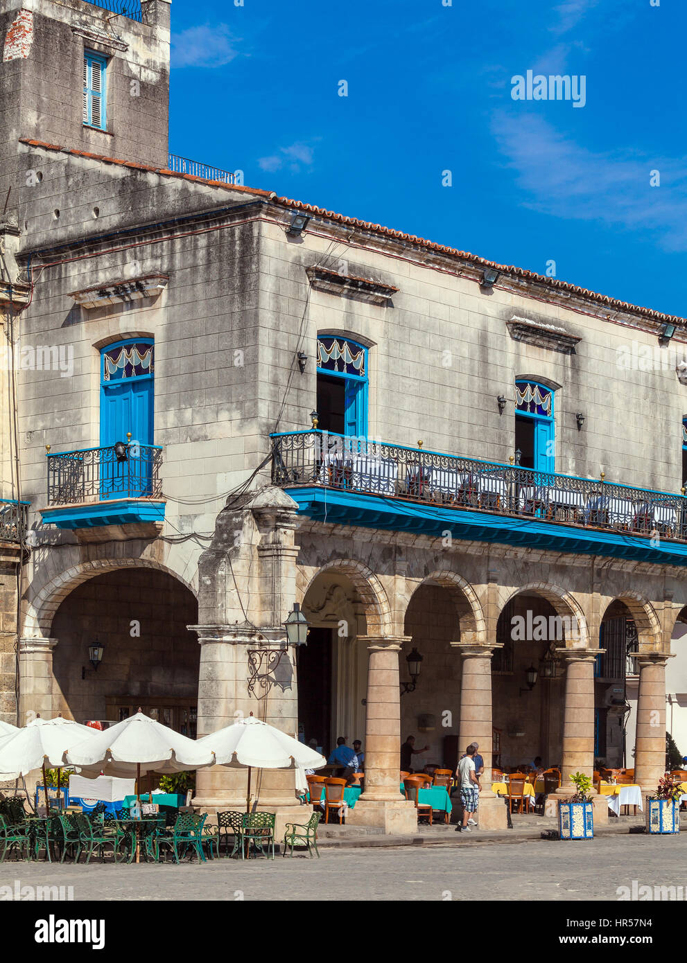 HAVANA, CUBA - APRIL 2, 2012: Tourist walking near El Patio Restaurant in the Cathedral Square Stock Photo