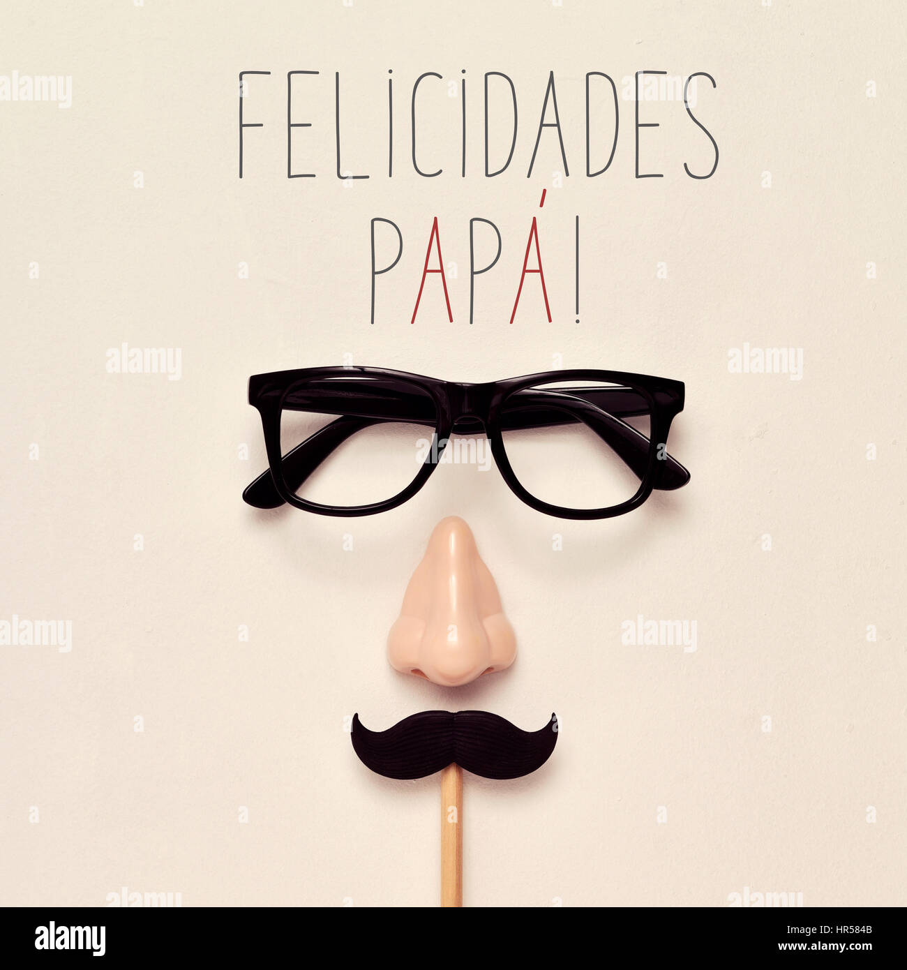 the text felicidades papa, congratulations daddy in spanish, a pair of