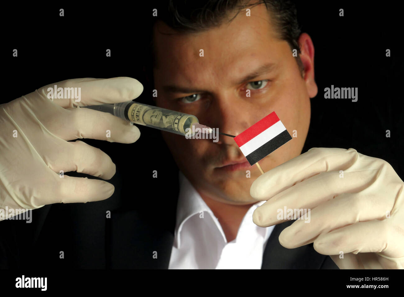 Fiscal Injection Young businessman gives a financial injection to Yemeni flag isolated ...