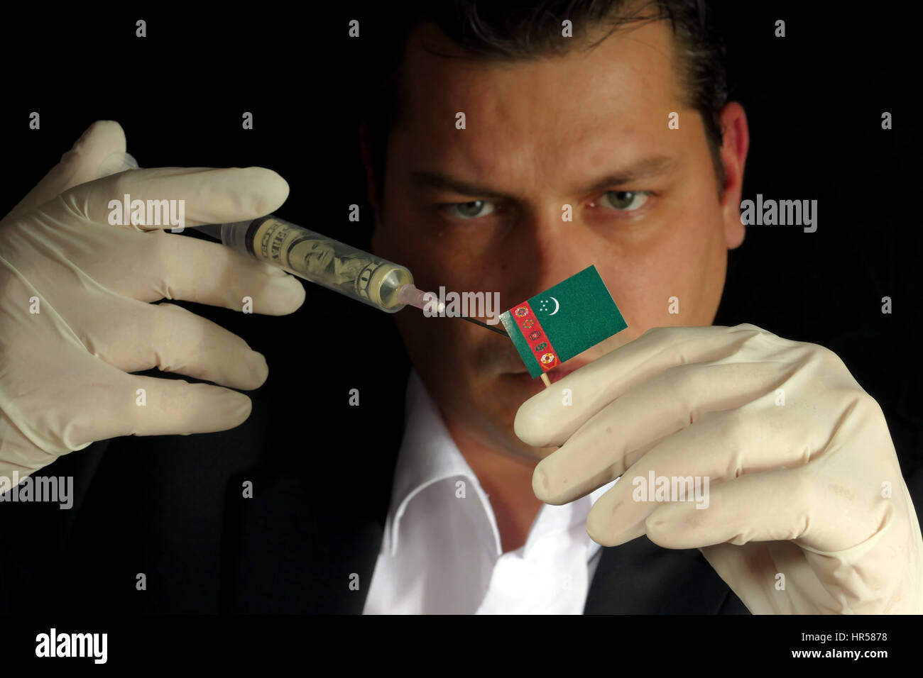 Fiscal Injection Young businessman gives a financial injection to Turkmenistani flag ...