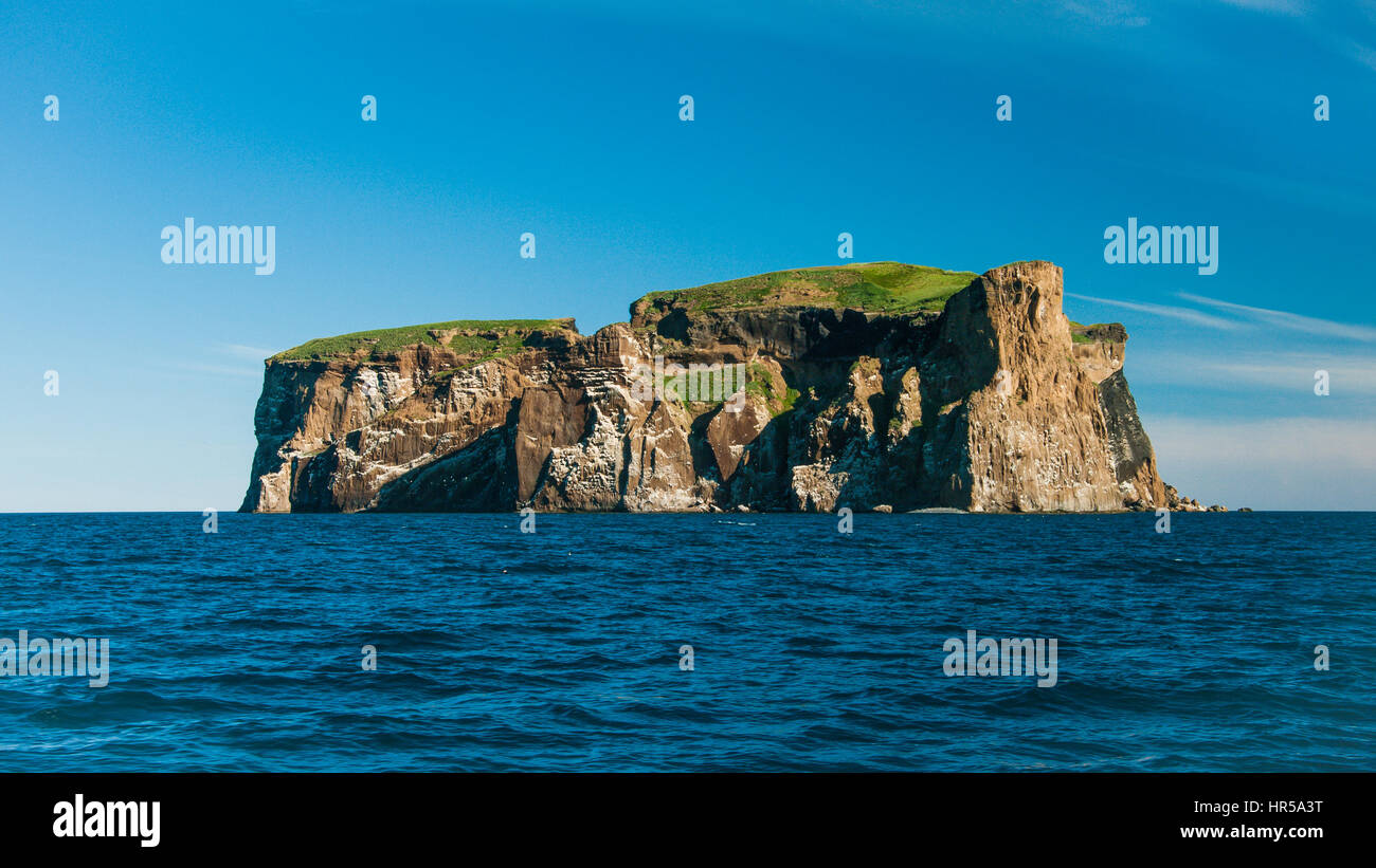 Imposing Drangey Island off the coast of Iceland Stock Photo
