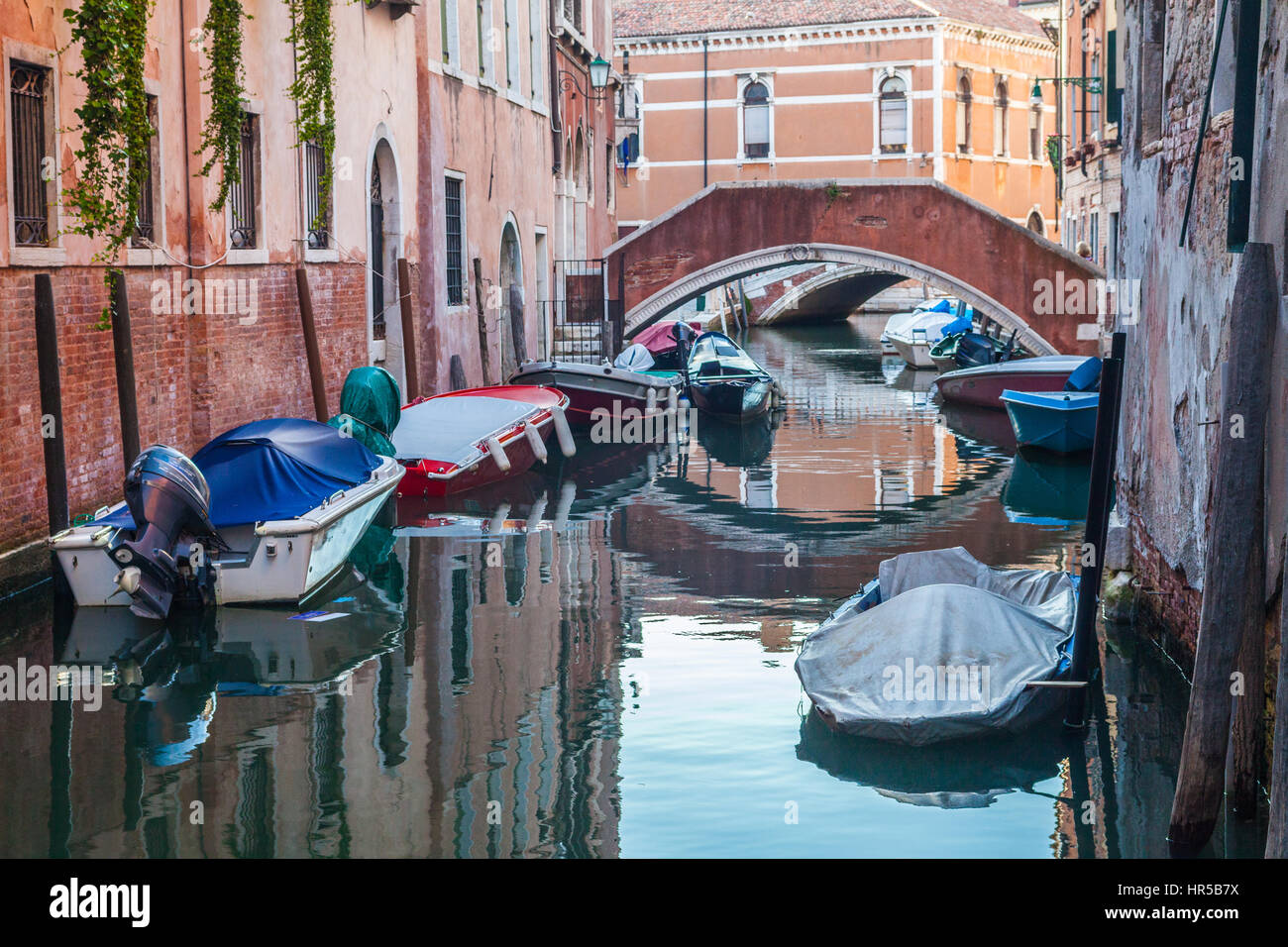 Reflections on venetian canal, Italy Stock Photo - Alamy