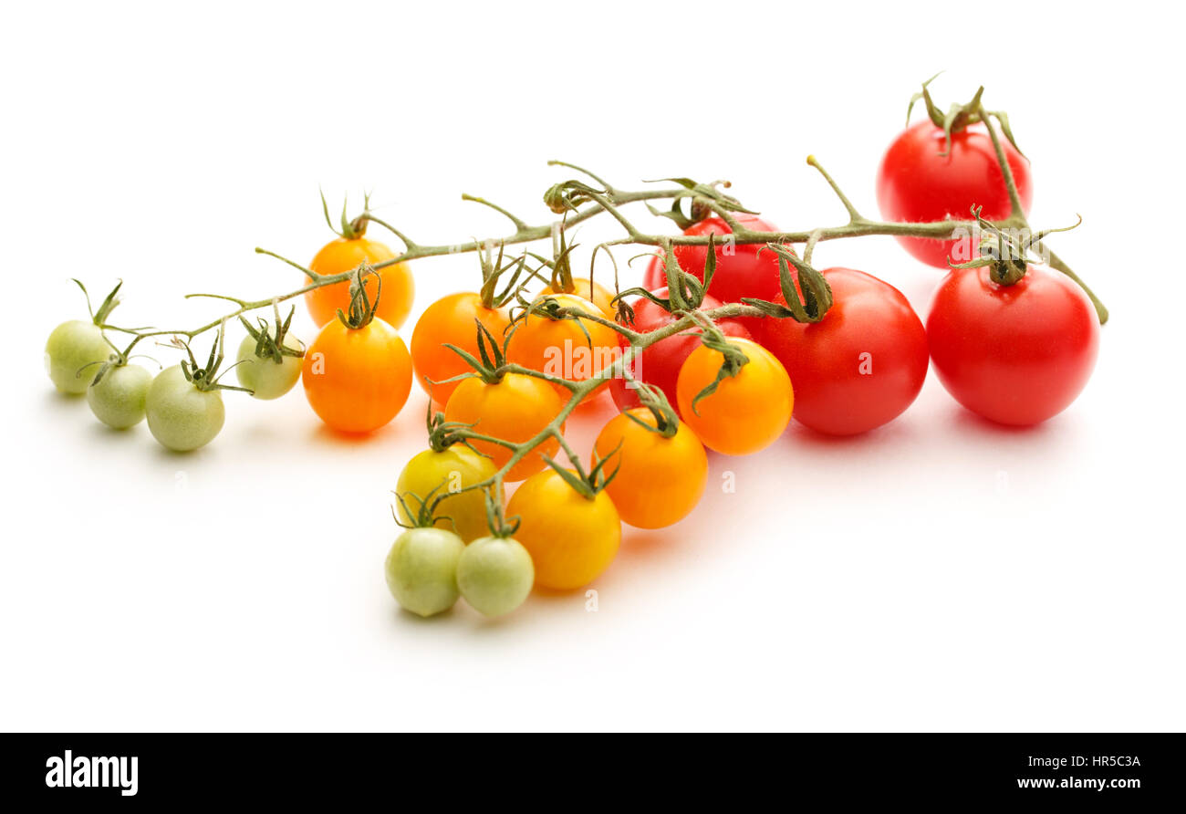 Fresh red and yellow tomatoes on white background Stock Photo - Alamy