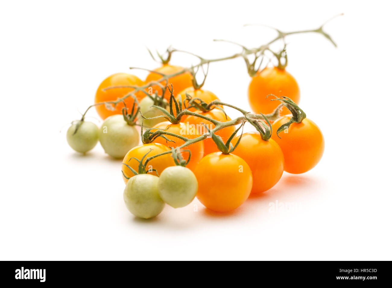 Fresh red and yellow tomatoes on white background Stock Photo - Alamy
