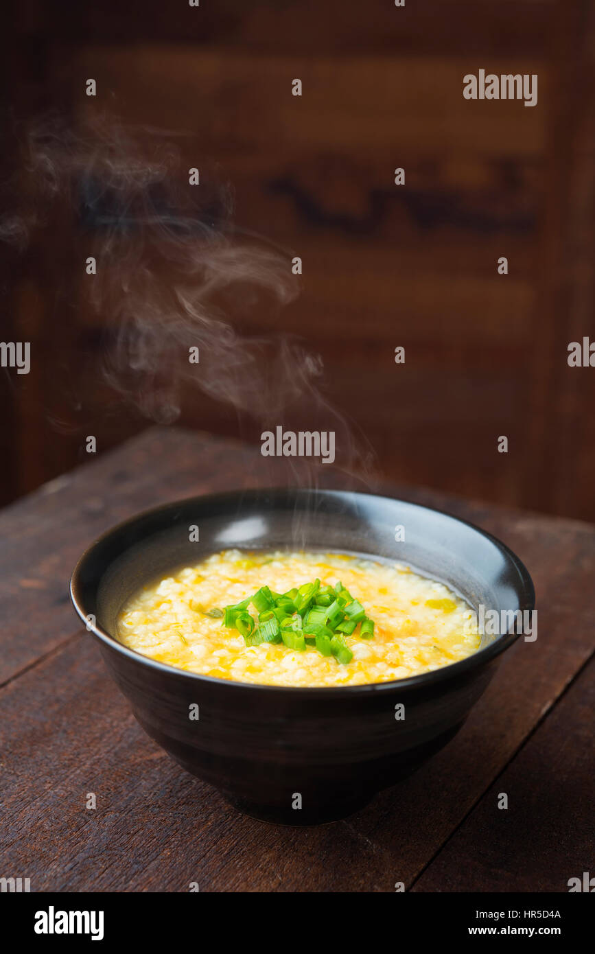 Asian porridge bowl on rustic wooden table background Stock Photo - Alamy