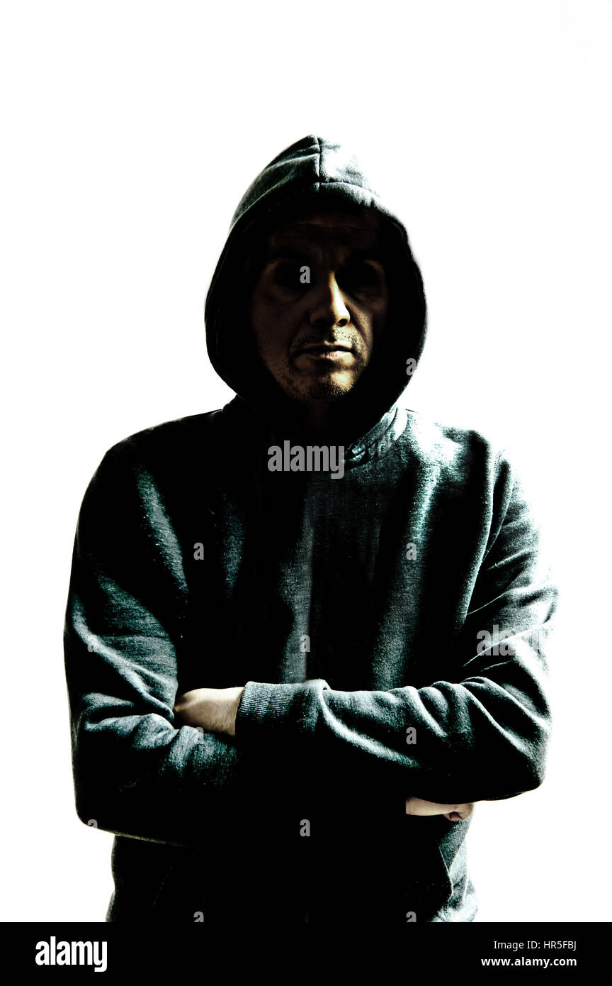 mysterious man in hood Stock Photo